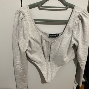 Nude Jersey long sleeve pointed hem corset